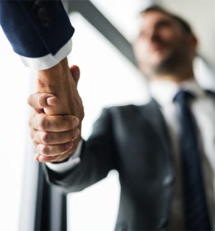 Business men shaking hands in a business or corporate transaction