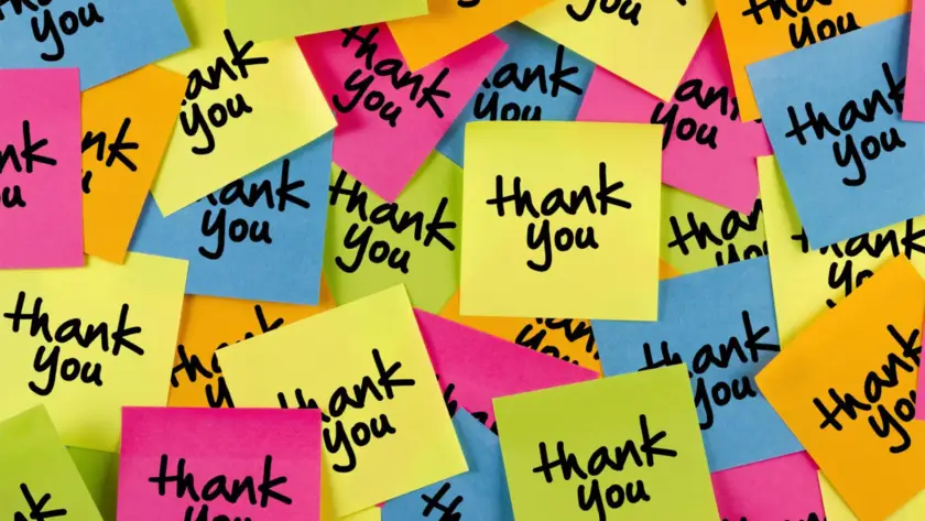 Colorful sticky notes with 'thank you' written on them scattered randomly.