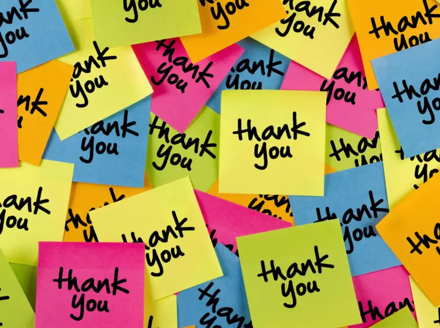 Colorful sticky notes with 'thank you' written on them scattered randomly.