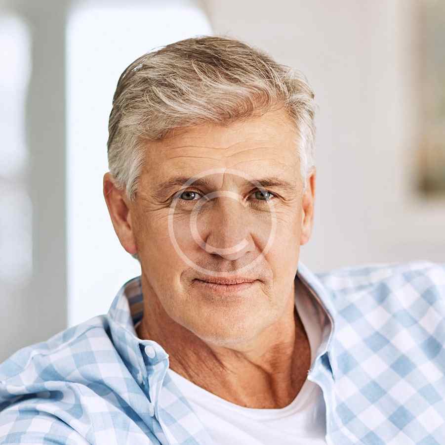 Portrait of a middle-aged man with gray hair and a thoughtful expression.