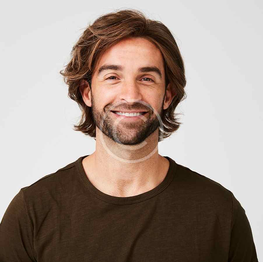 Smiling man with medium-length hair and beard wearing a brown shirt.