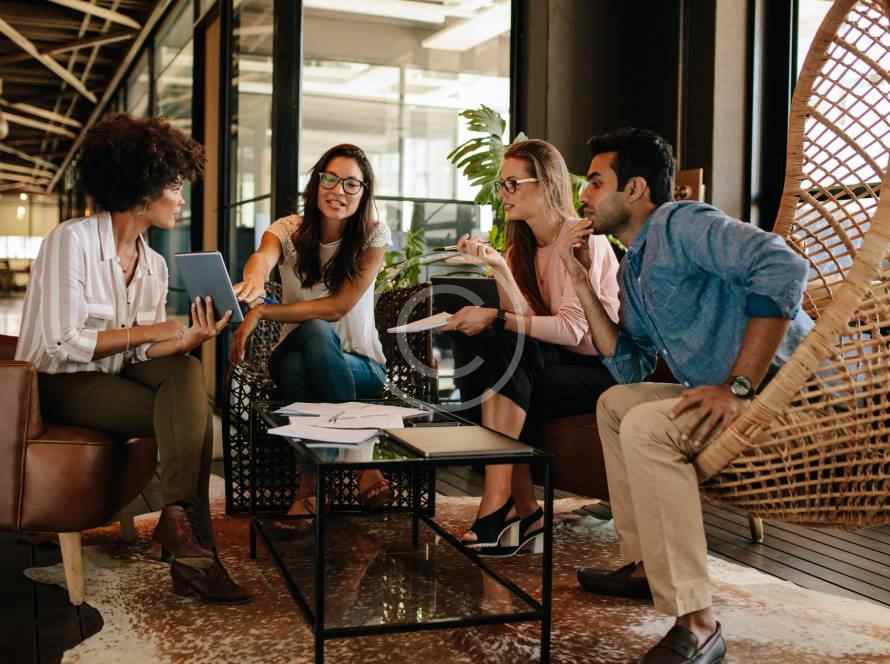 Four friends enjoying coffee and conversation in a cozy café.