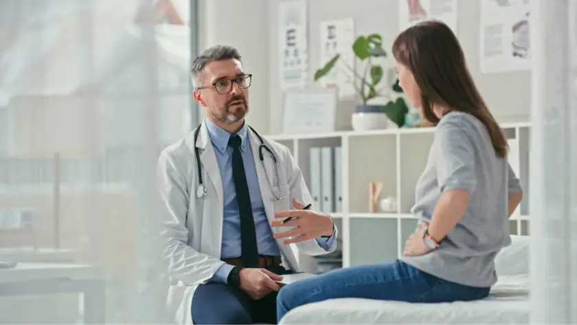 Doctor consulting a patient in a medical office.