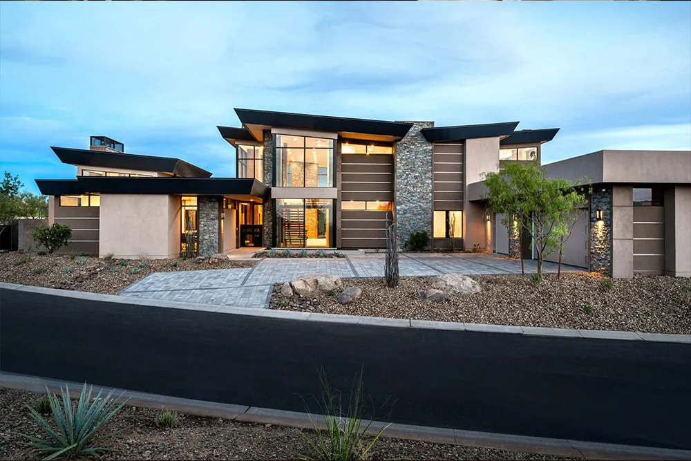 Modern luxury house with expansive windows and elegant lighting.