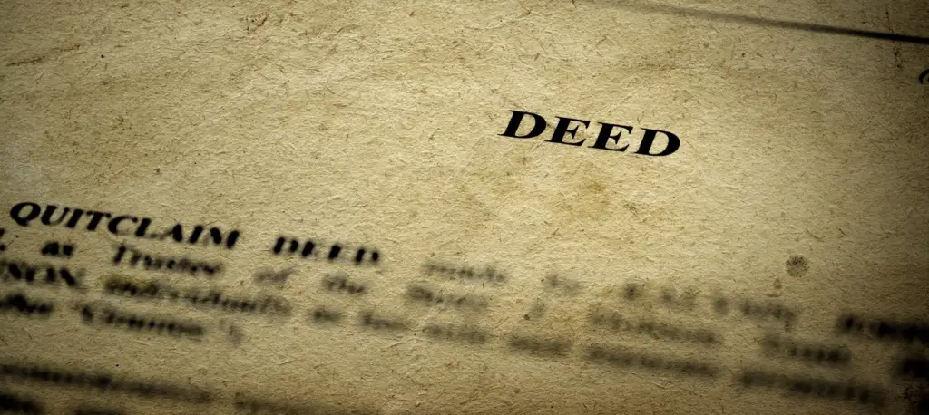 Close-up of a legal deed document on textured paper.