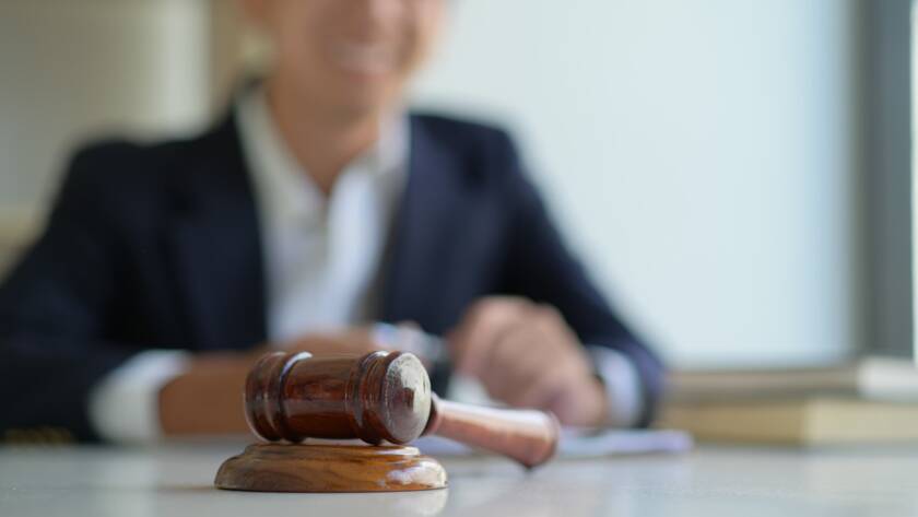 Judge in the courtroom with a gavel.