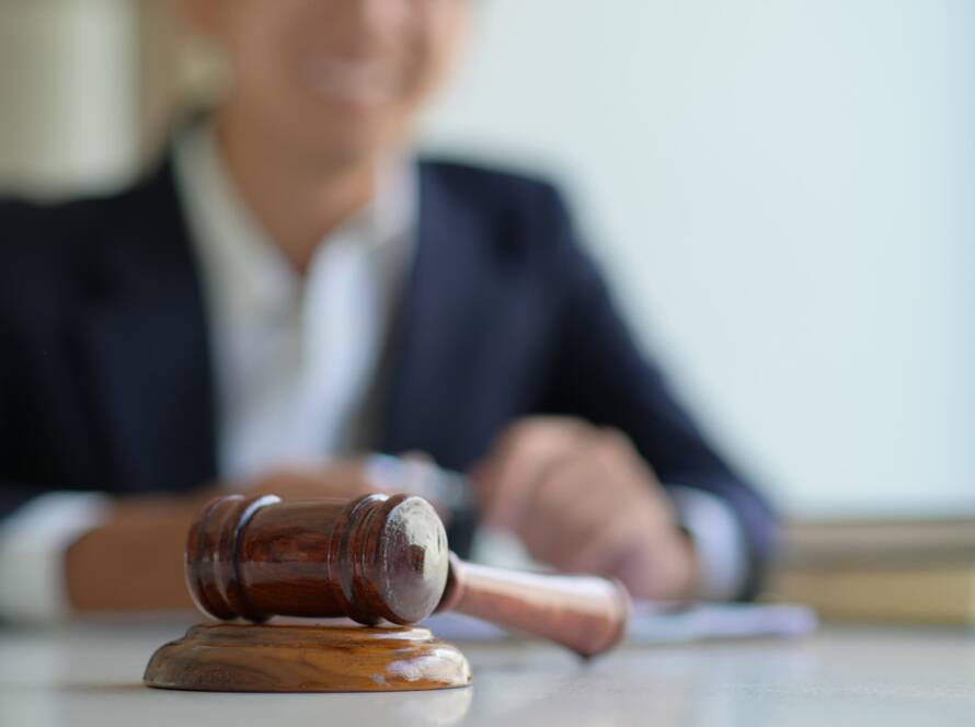 Judge in the courtroom with a gavel.