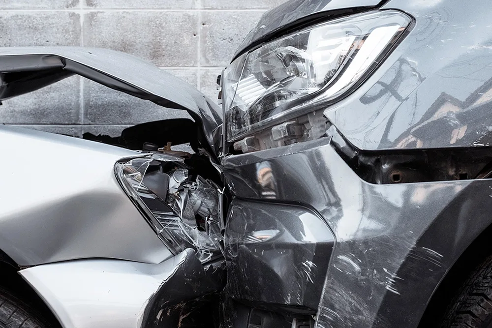 Close-up of a car with a severely damaged front end.